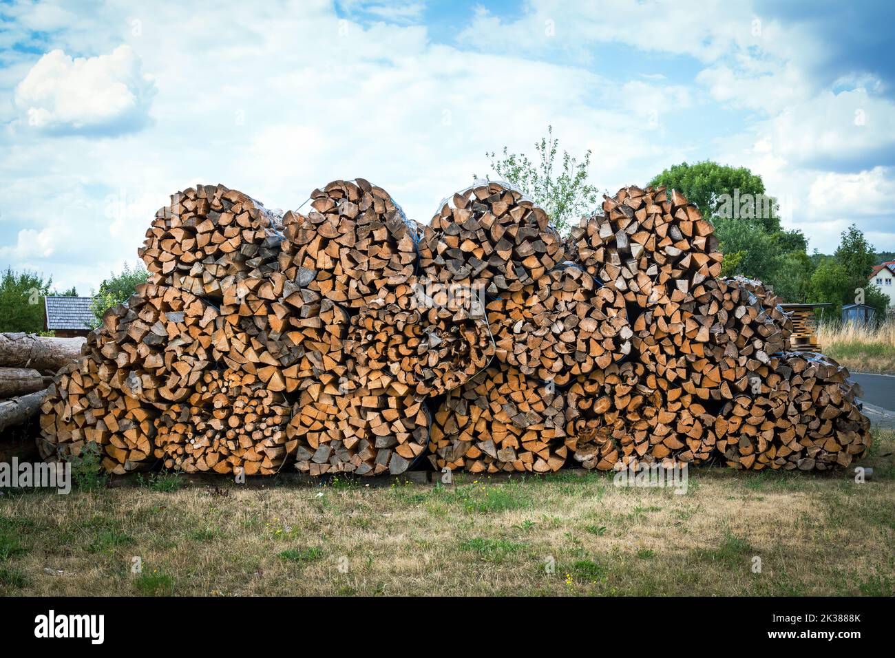 chopped wood in a stack outdoors Stock Photo