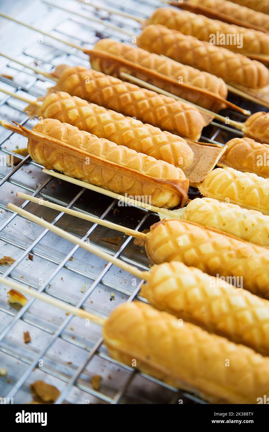 Detail of the Thai street food hot dog waffle sticks in Bangkok Stock Photo