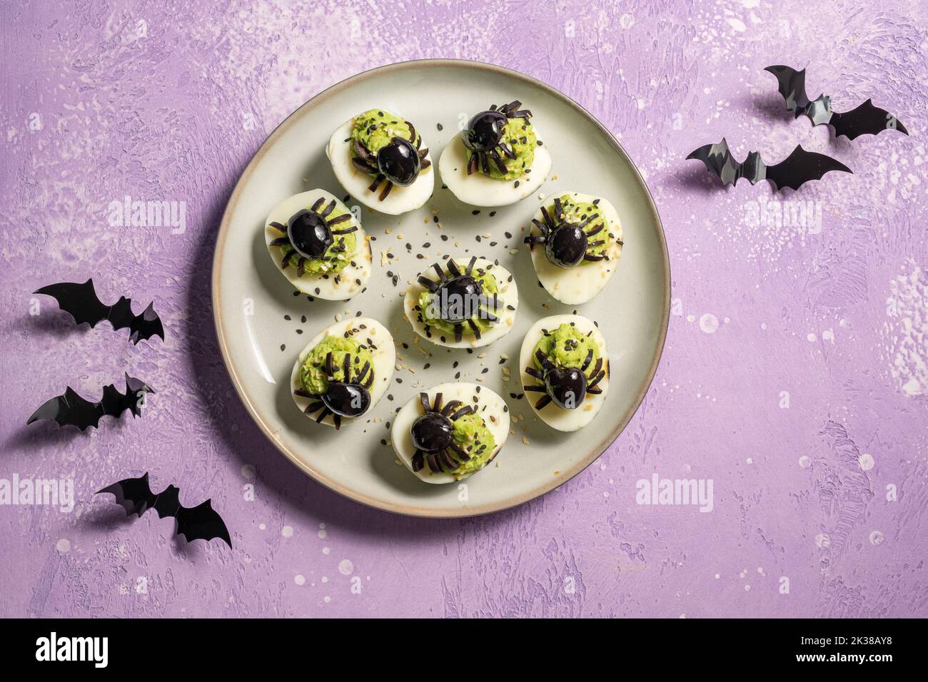 Deviled eggs with avocado. Spider for Halloween party Stock Photo