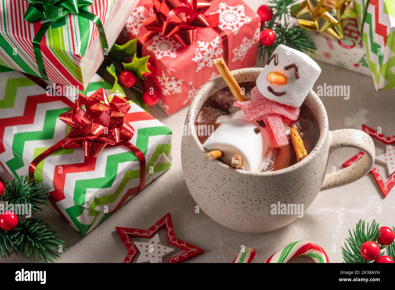 Mug with hot chocolate with melted marshmallow snowman. Merry Christmas drink. Happy Holiday card Stock Photo