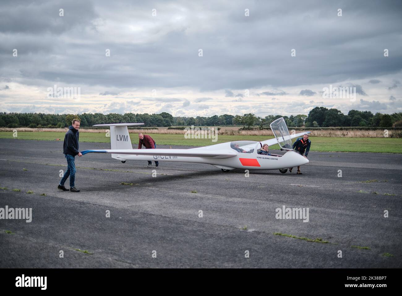 A glider on the runway at Rufforth Airfield, York ready to be towed up into the sky by a tug Stock Photo