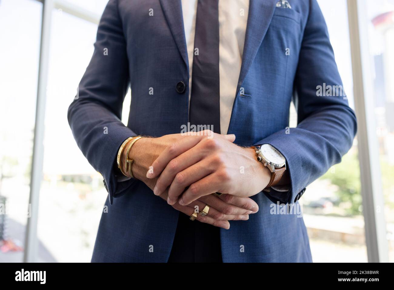 Close up businessman in suit with hands clasped Stock Photo