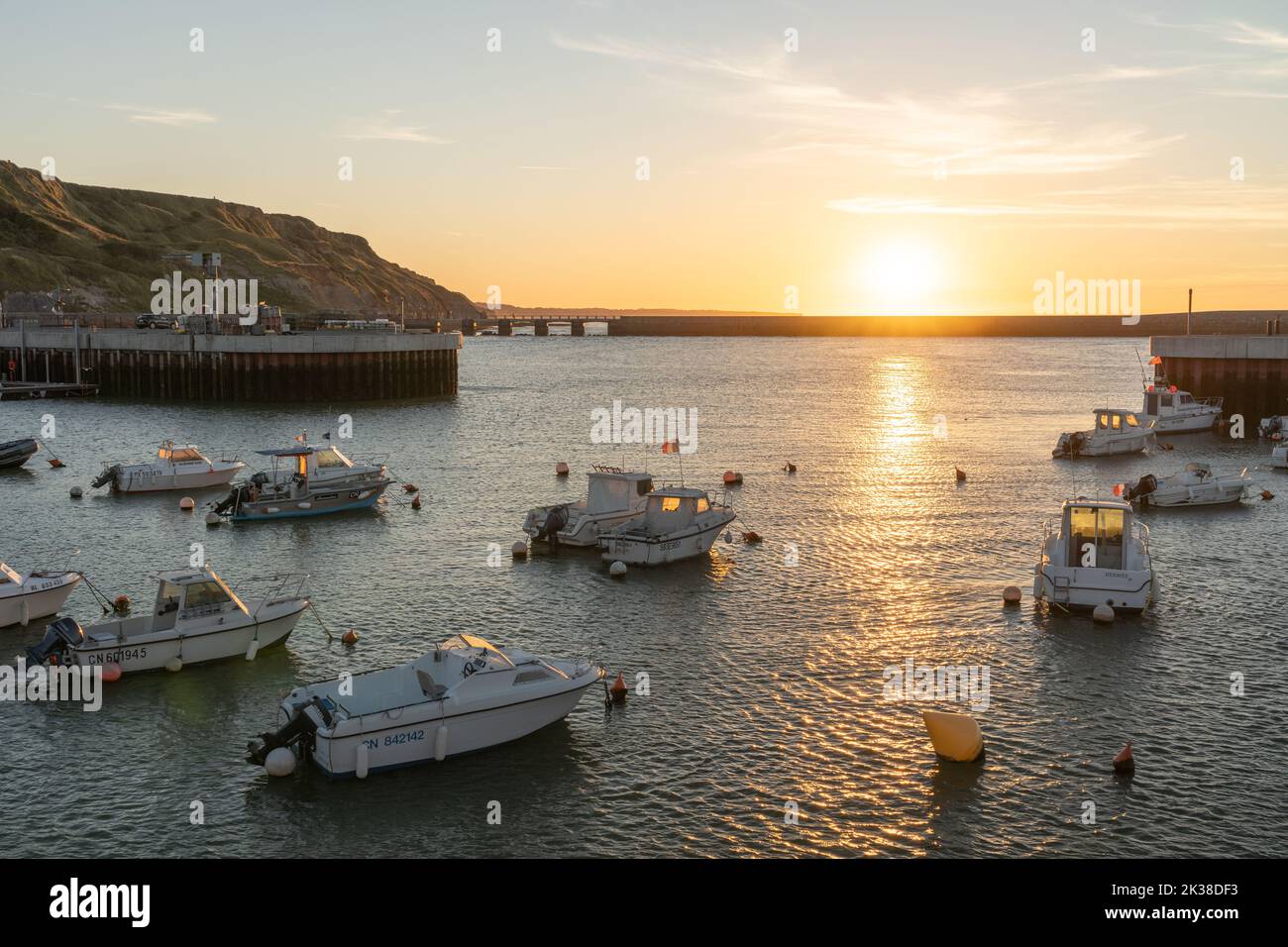 Boats in the harbour at sunset at Port-en-Bessin, Normandie Stock Photo