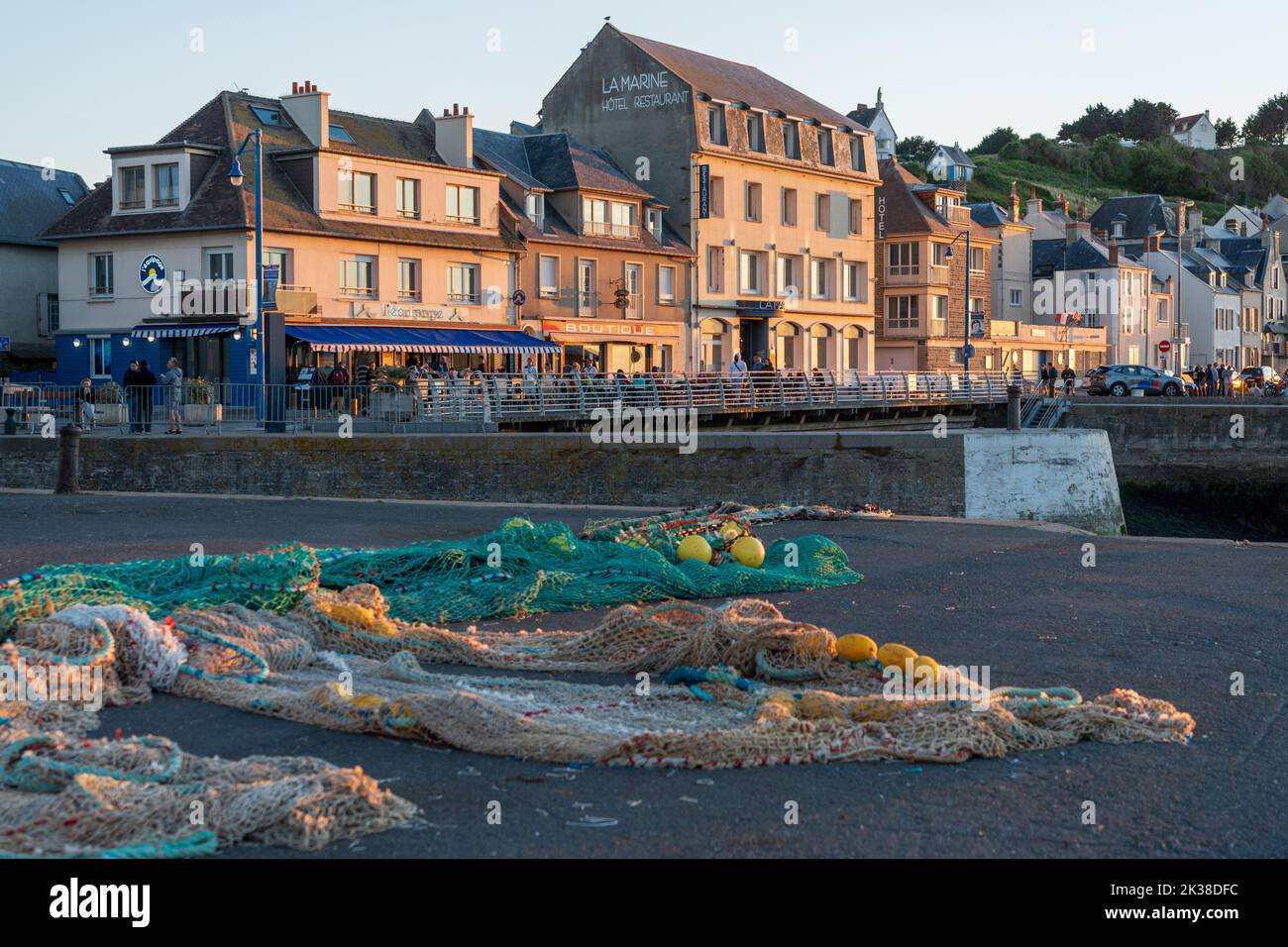 The fishing town of Port-en-Bessin bathed in sunset colours Stock Photo