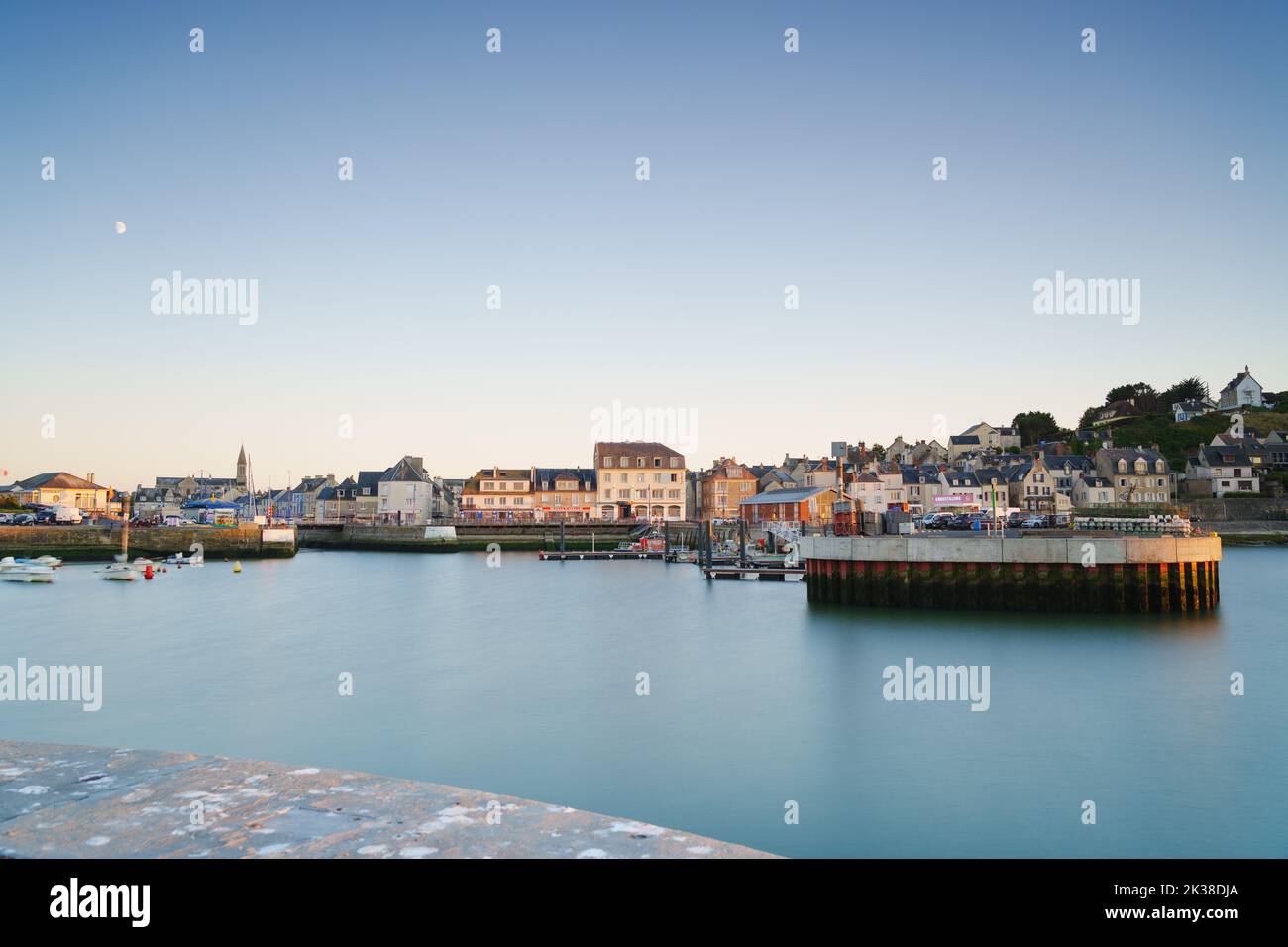 The fishing town of Port-en-Bessin, as seen from the sea wall looking across the harbour. Stock Photo