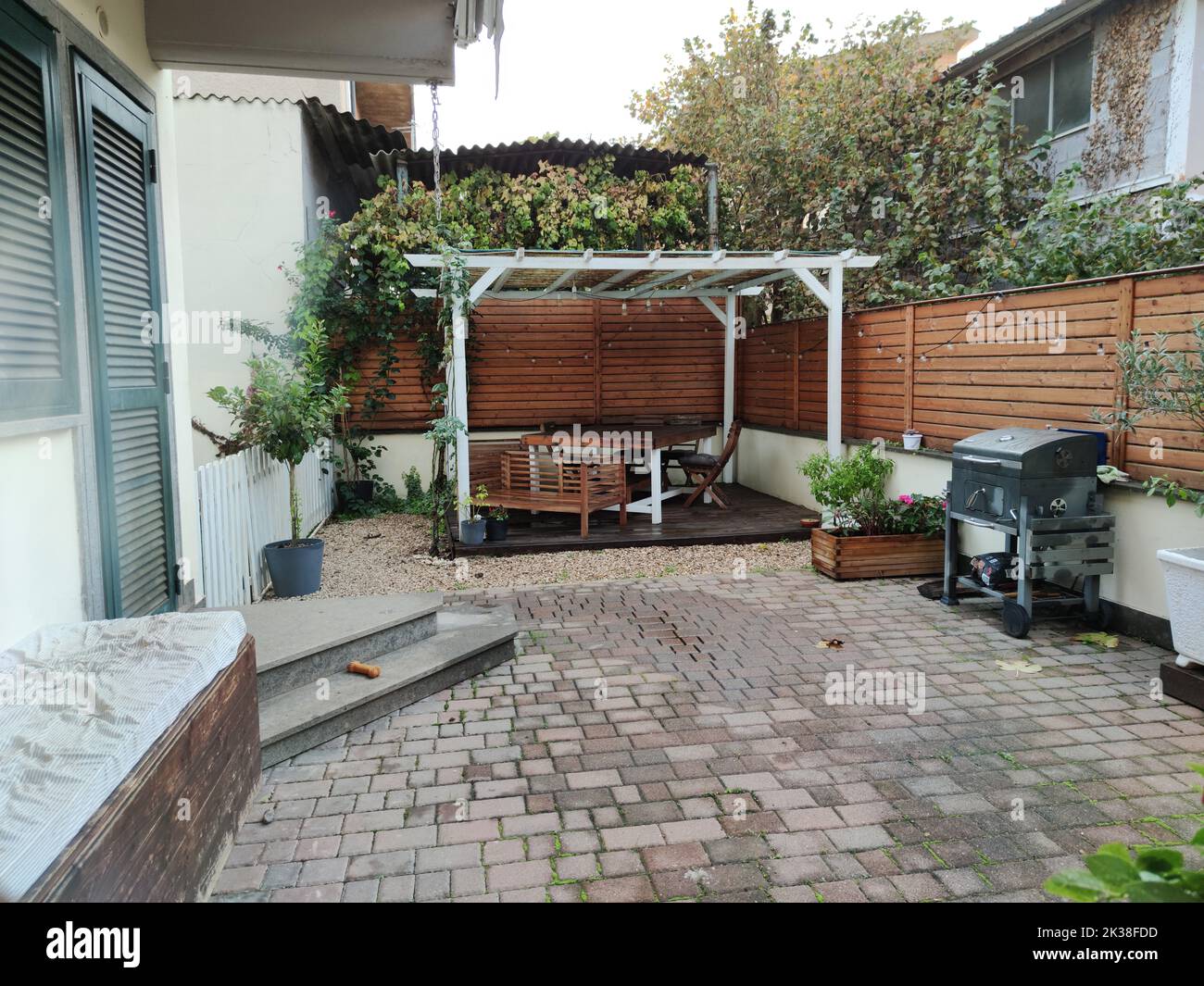 Gazebo with lights at night. Picture of a summer house with comfortable