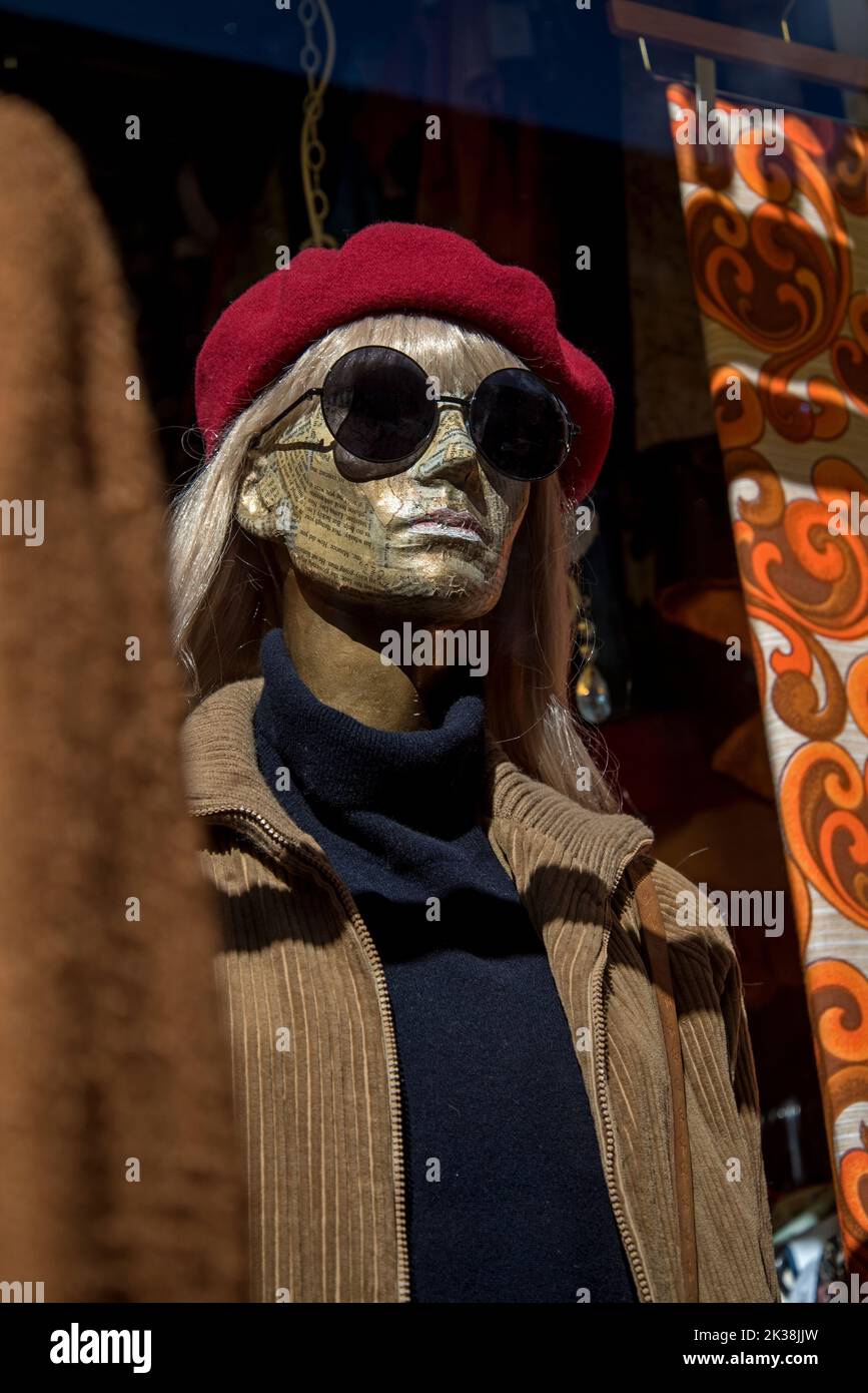 Female mannequin with sunglasses and red beret in the window of W Armstrong & Son, vintage clothes retailer, Teviot Place, Edinburgh, Scotland, UK. Stock Photo