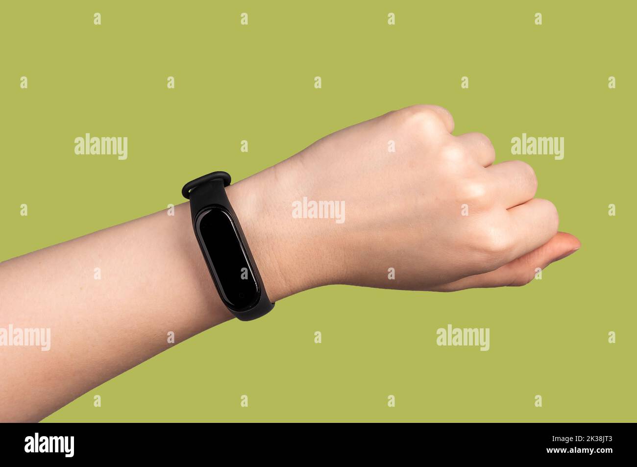Fitness bracelet on female hand closeup, smart fit watch, pedometer. High quality photo Stock Photo