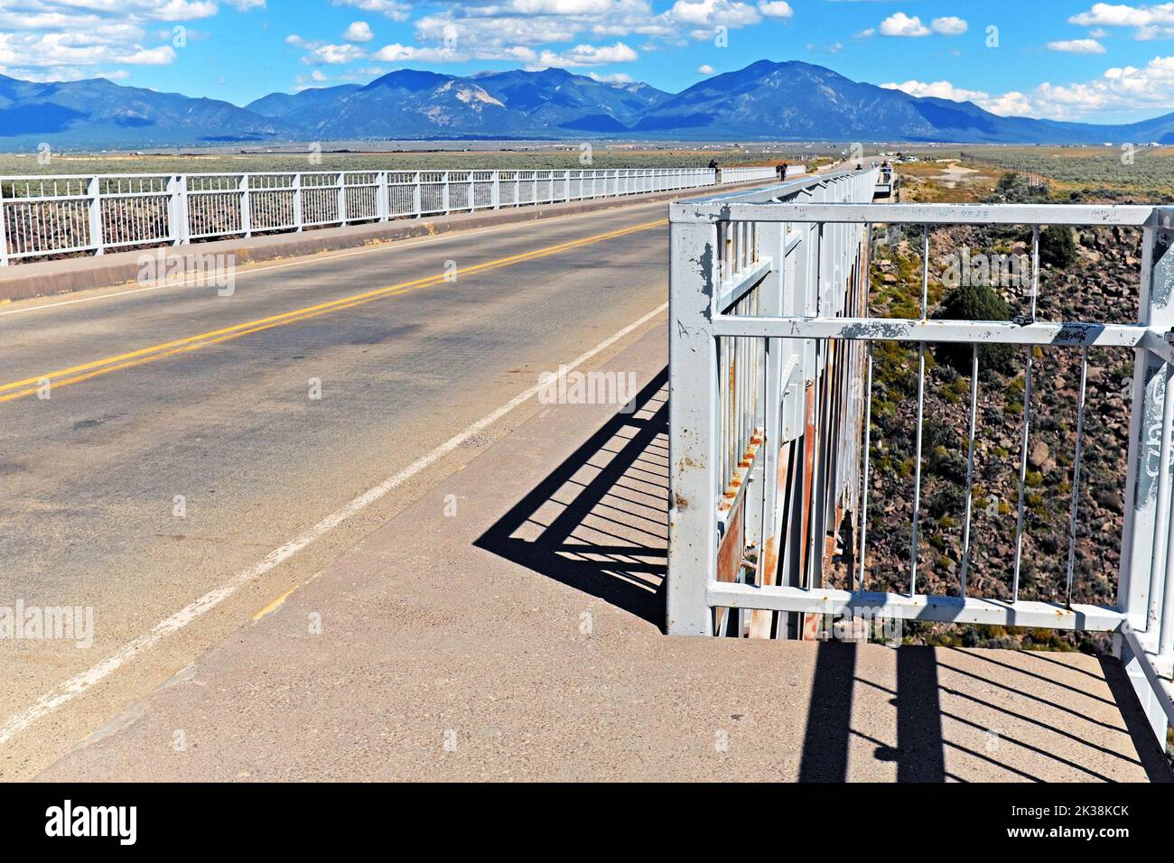 Approximately 600 feet over the Rio Grande, the steel deck arch bridge with pedestrian viewpoints on both sides near Taos, New Mexico. Stock Photo