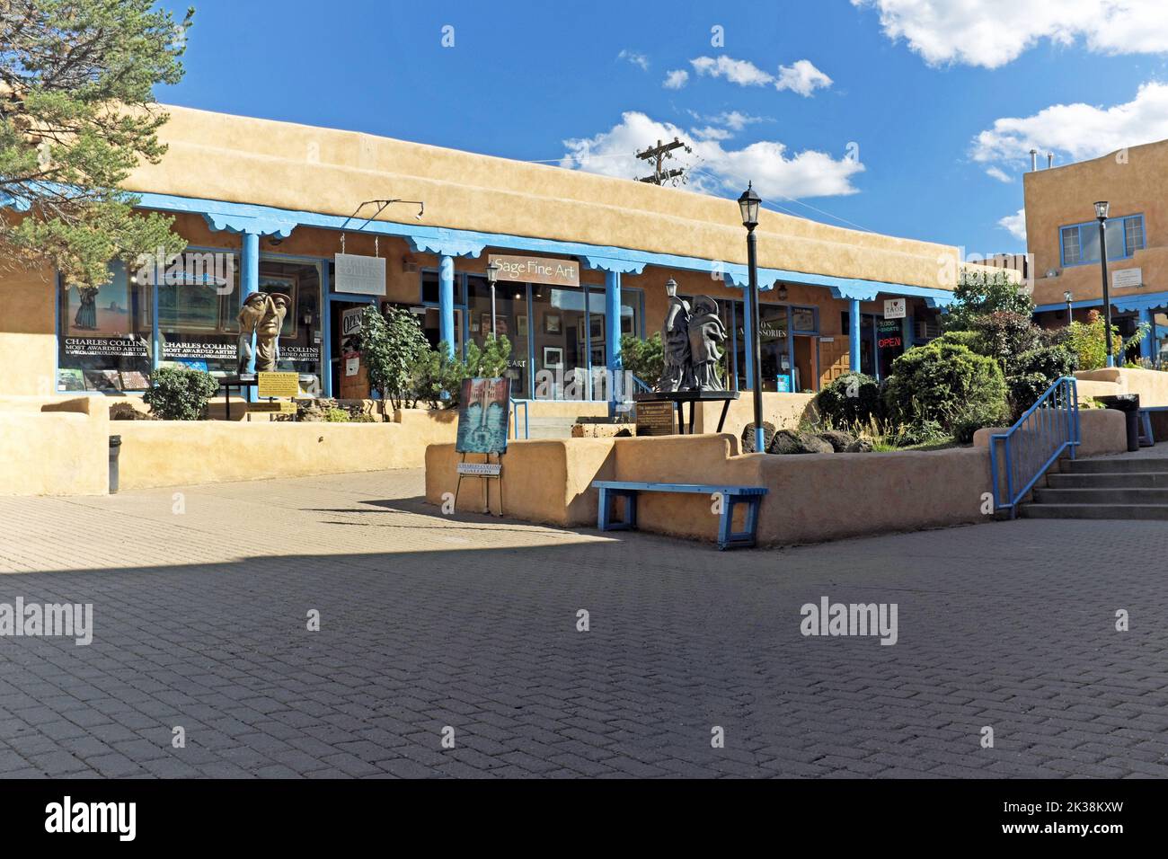 A section of the outdoor historic Taos Plaza in Taos, New Mexico, includes public art attesting to the artistic vibe of the area. Stock Photo