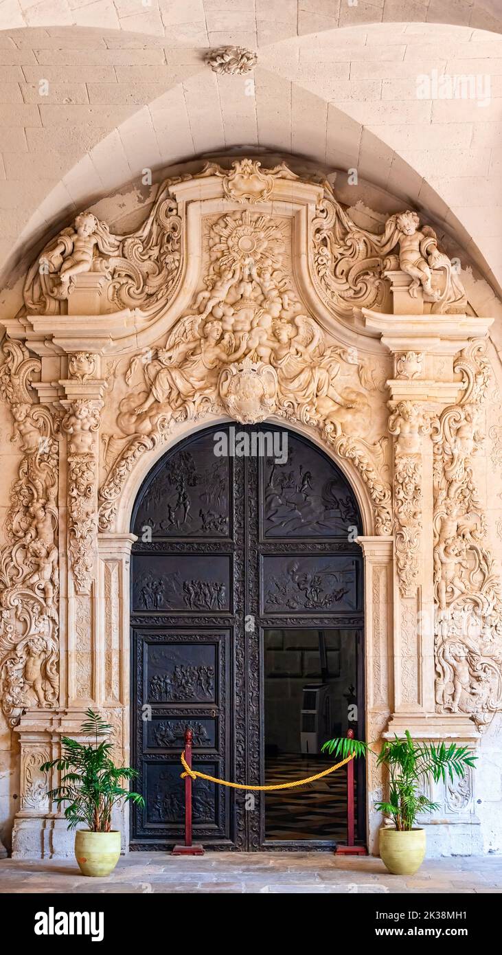 Front view of the medieval door in the medieval building interior. Stock Photo
