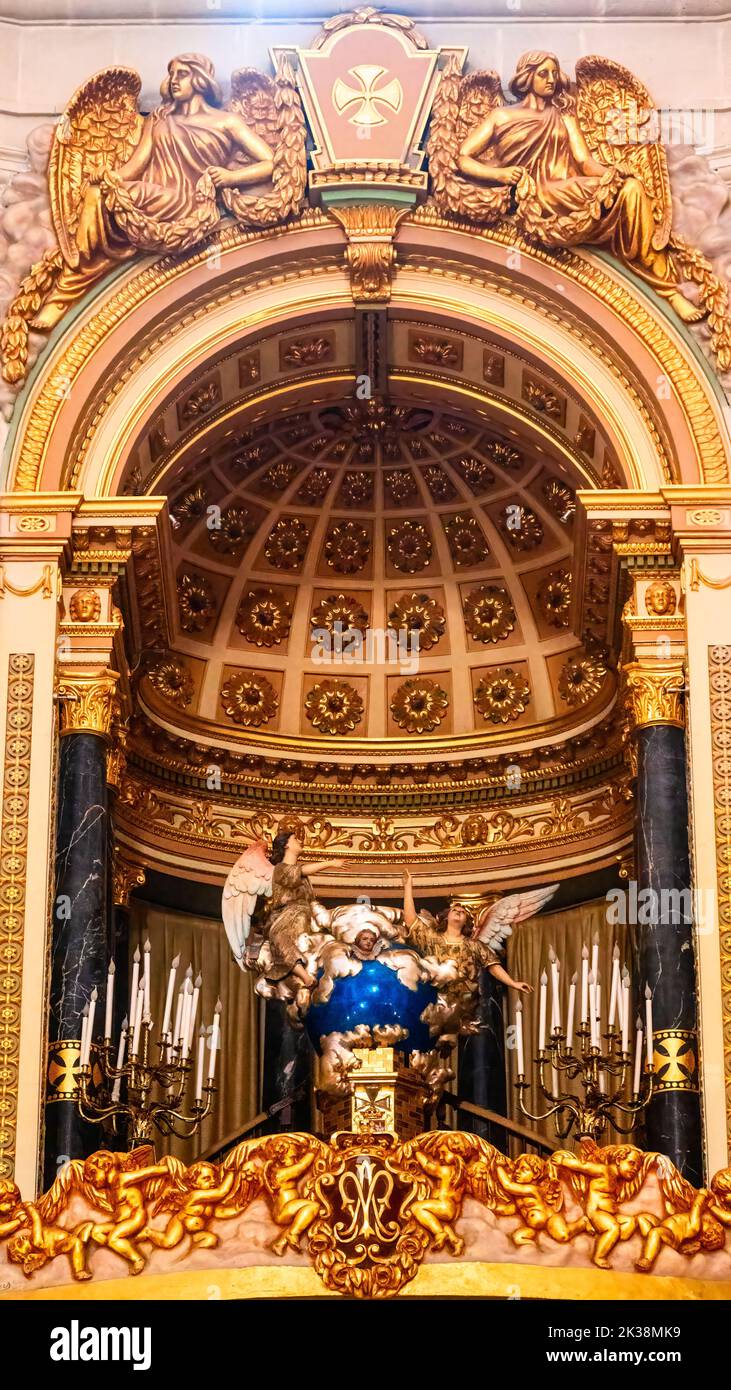 Religious saint below a semi-circular dome or cupola with golden colors. Stock Photo
