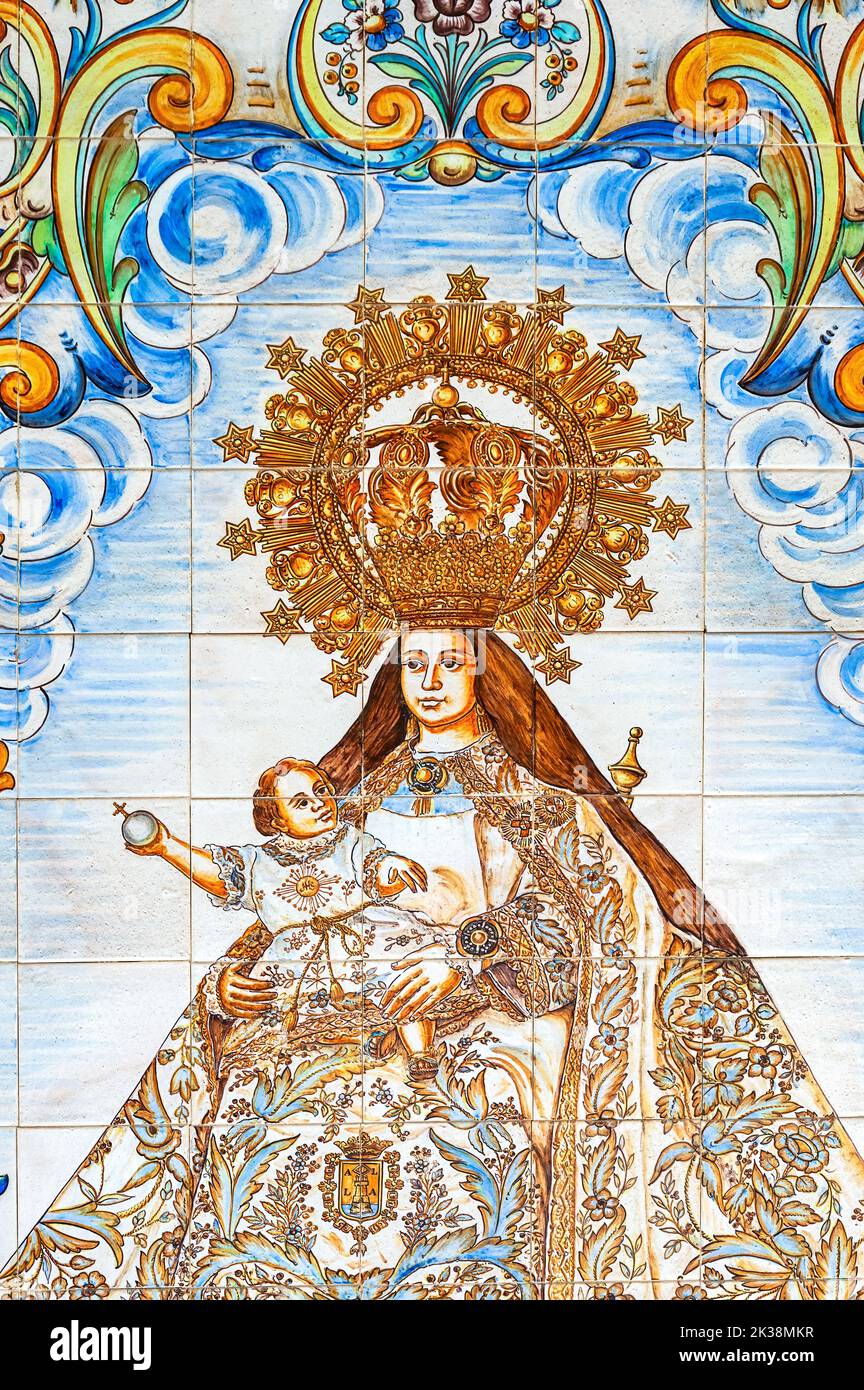 Tile painting of the Virgin Mary decorating a wall inside of the medieval building. Stock Photo