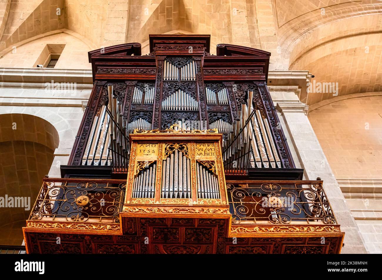 Pipe organ in the interior of the famous medieval building. Low angle view Stock Photo
