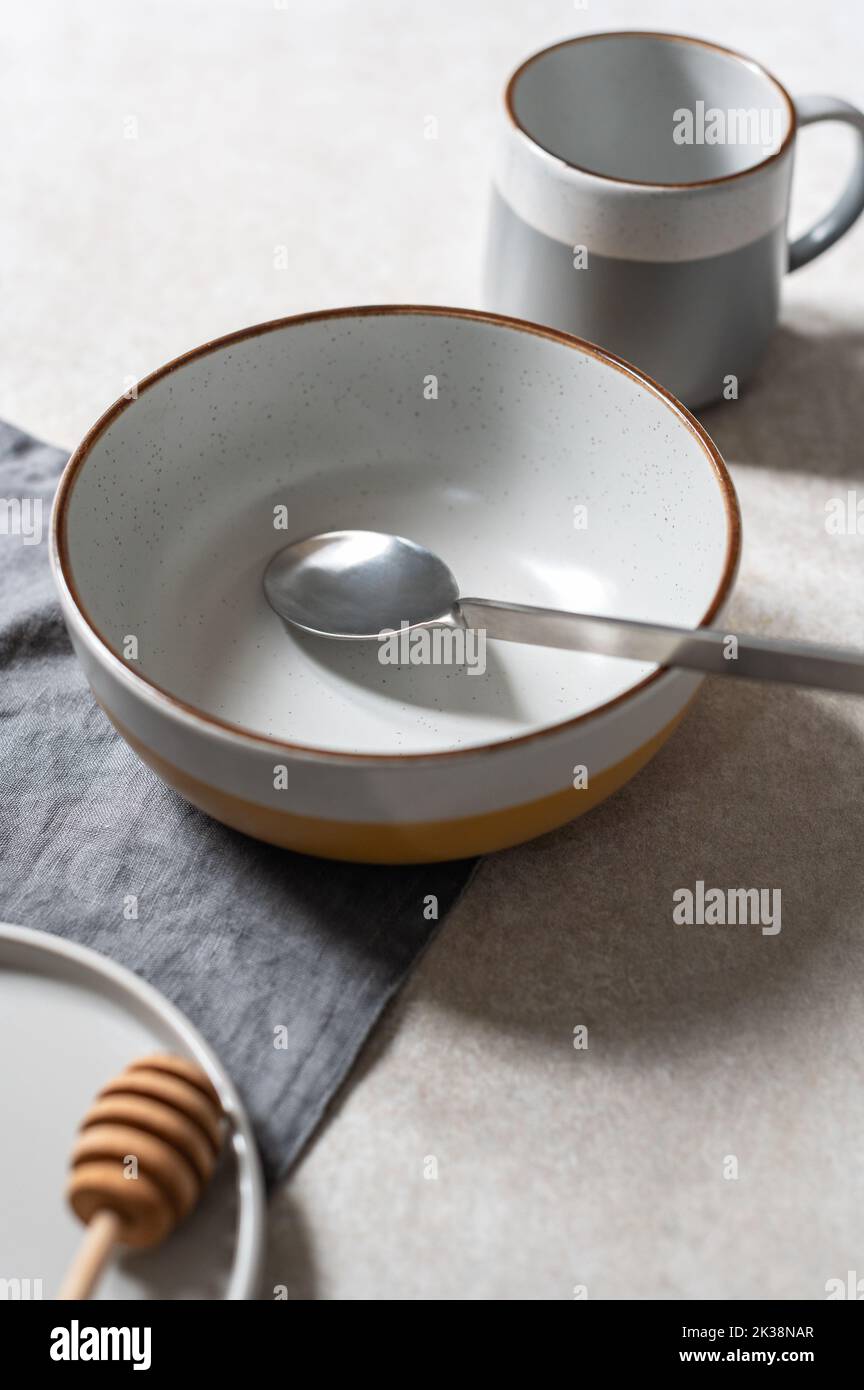 Empty plates on grey background Stock Photo