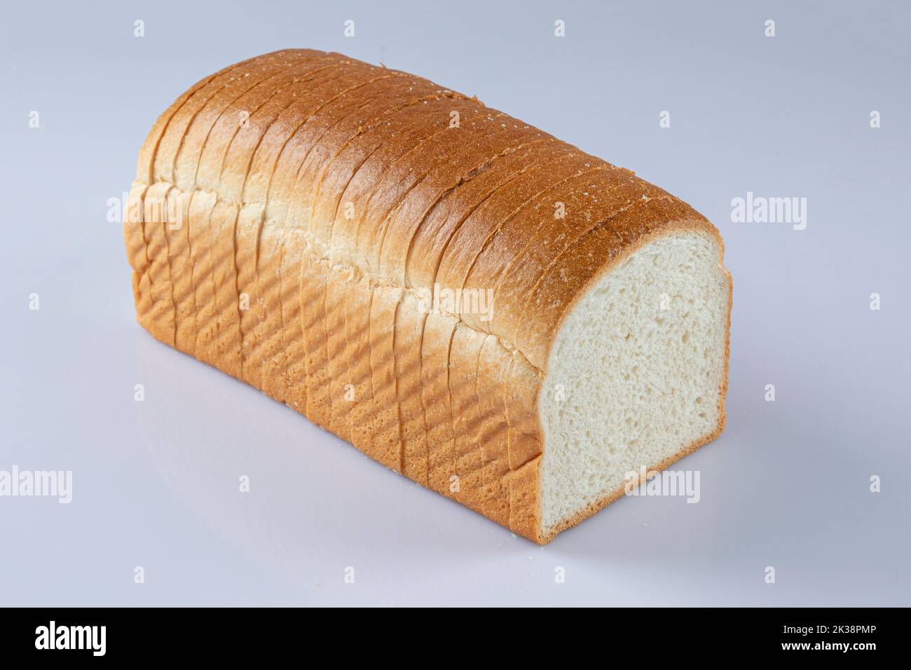 whole wheat bread slices on a white background Stock Photo - Alamy