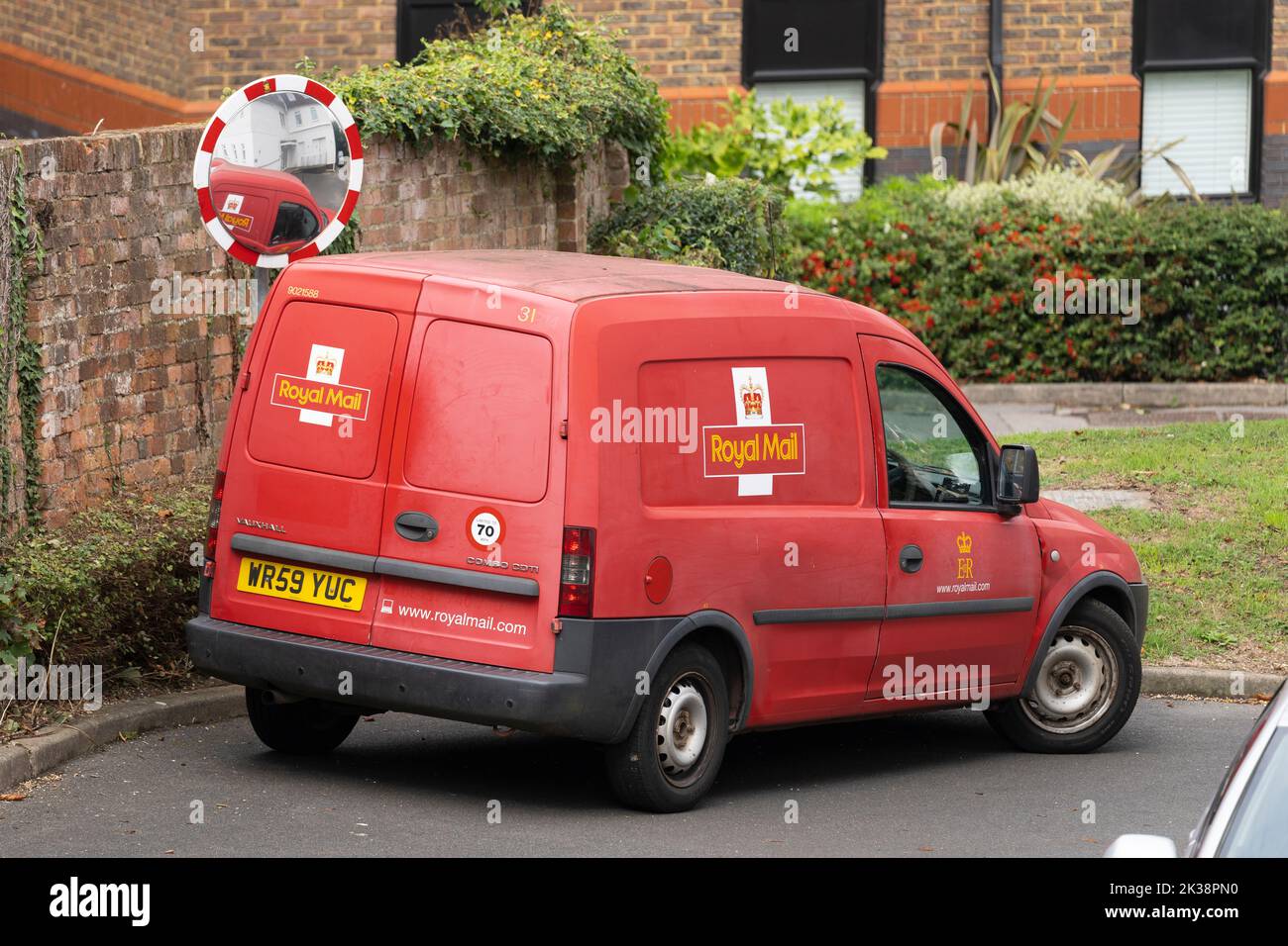 Royal Mail Group red delivery van with traditional logo. England, UK. Concept - Royal Mail brand, postal service, mail collection, parcel delivery Stock Photo