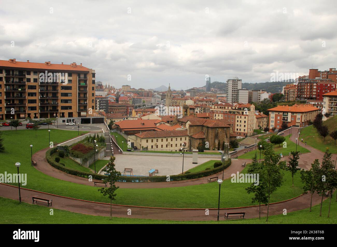 A beautiful view of a park and apartment buildings in Bilbao Stock ...