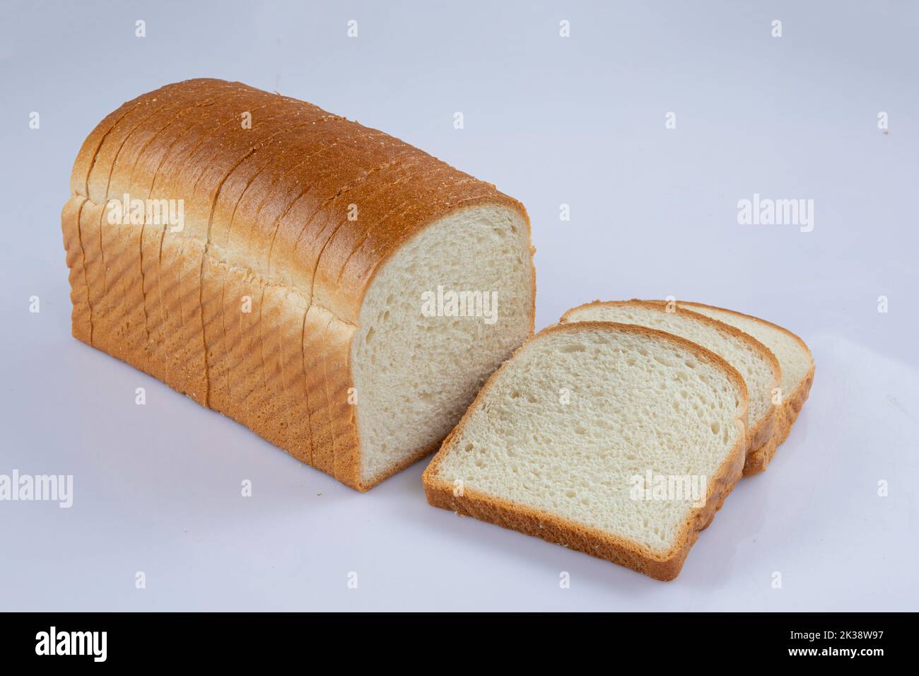 whole wheat bread slices on a white background Stock Photo - Alamy