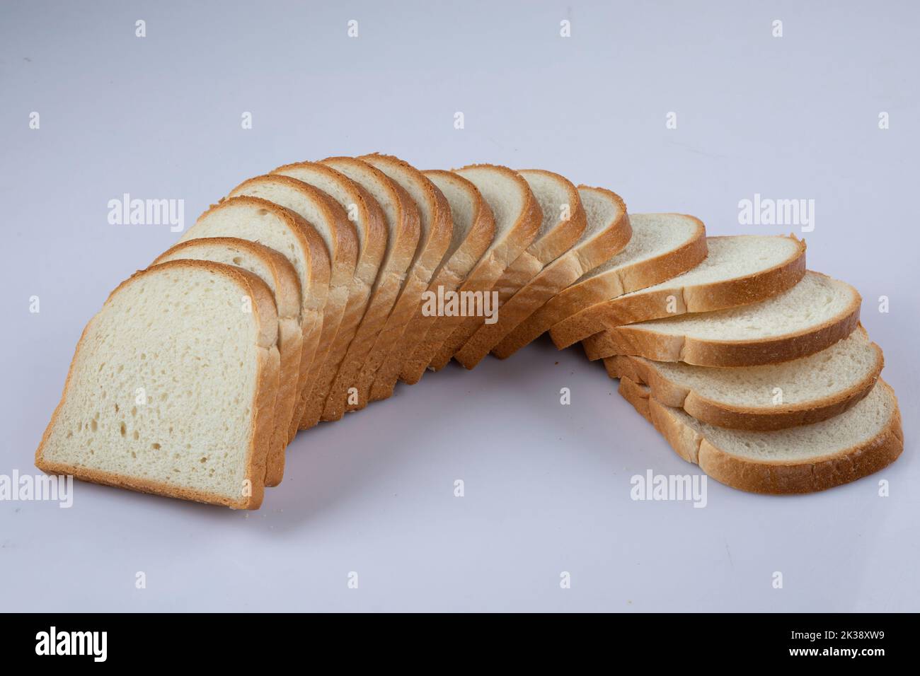 whole wheat bread slices on a white background Stock Photo - Alamy