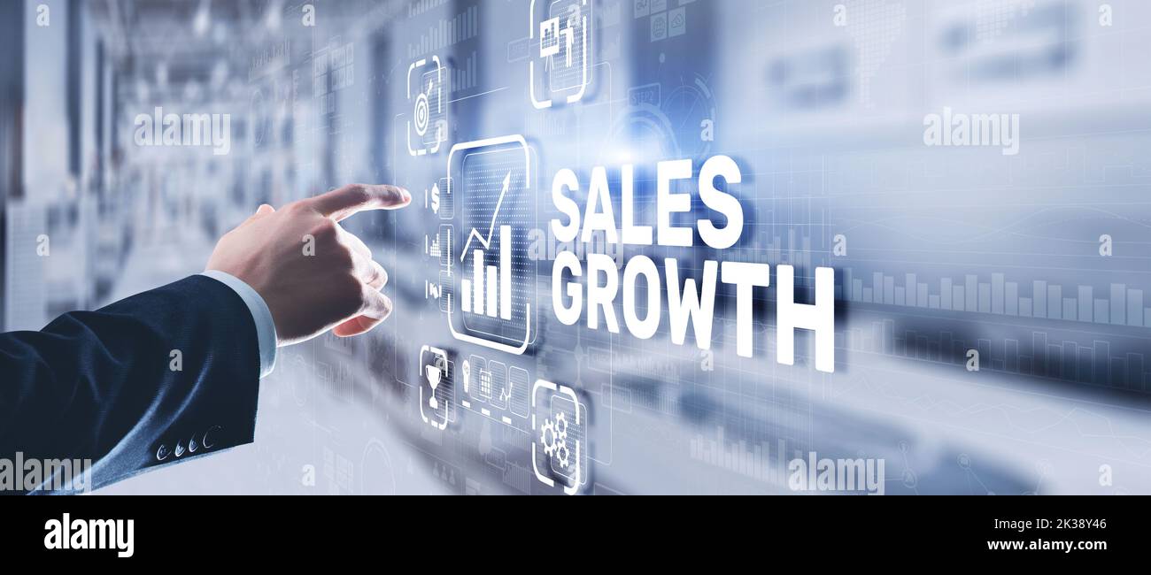 Sales Growth Man clicks inscription on virtual 3D screen. Stock Photo