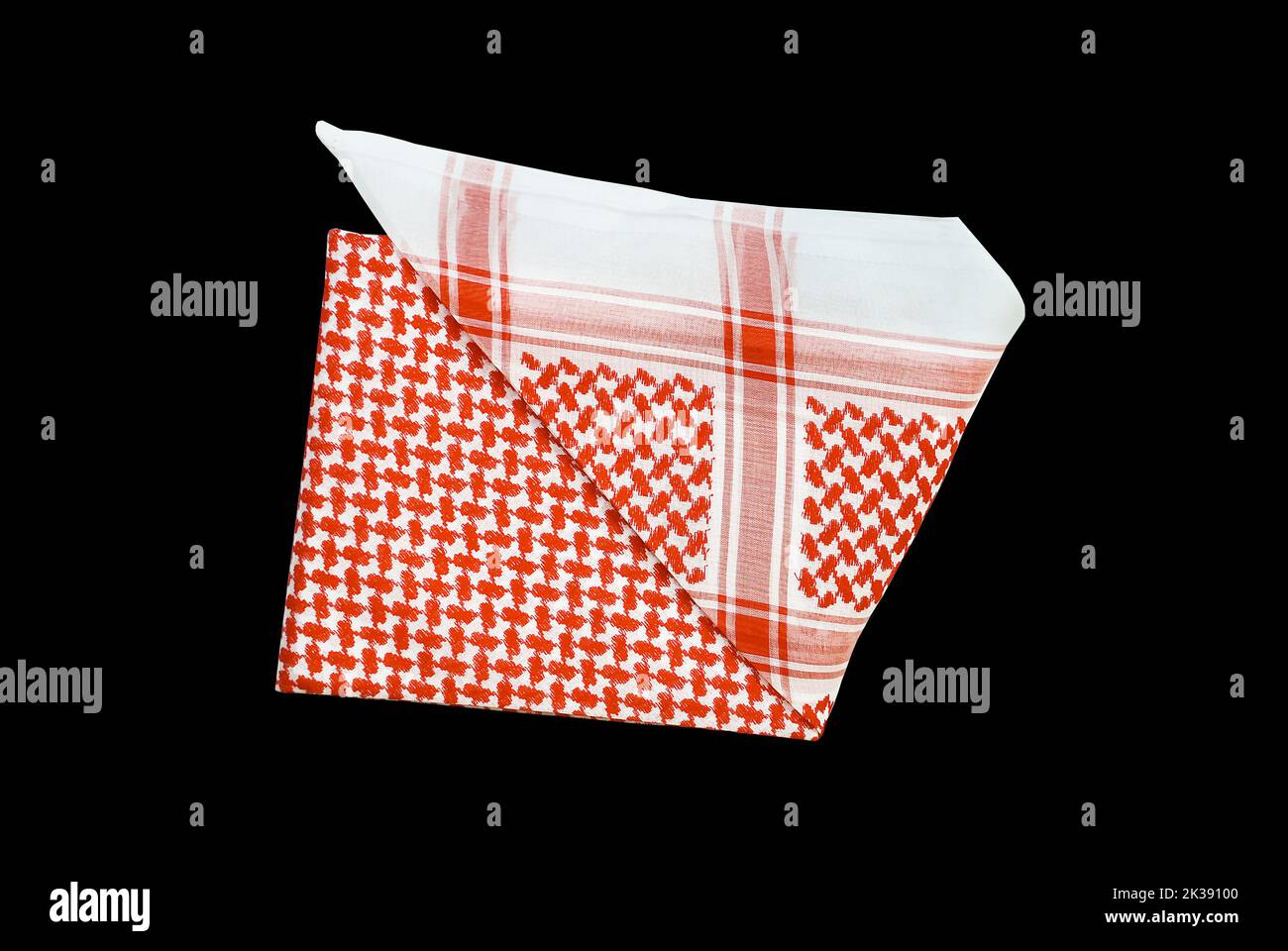 saudi men clothing accessory head scarf red shemagh closeup black background space for text luxury traditional Arabic men dressing Stock Photo