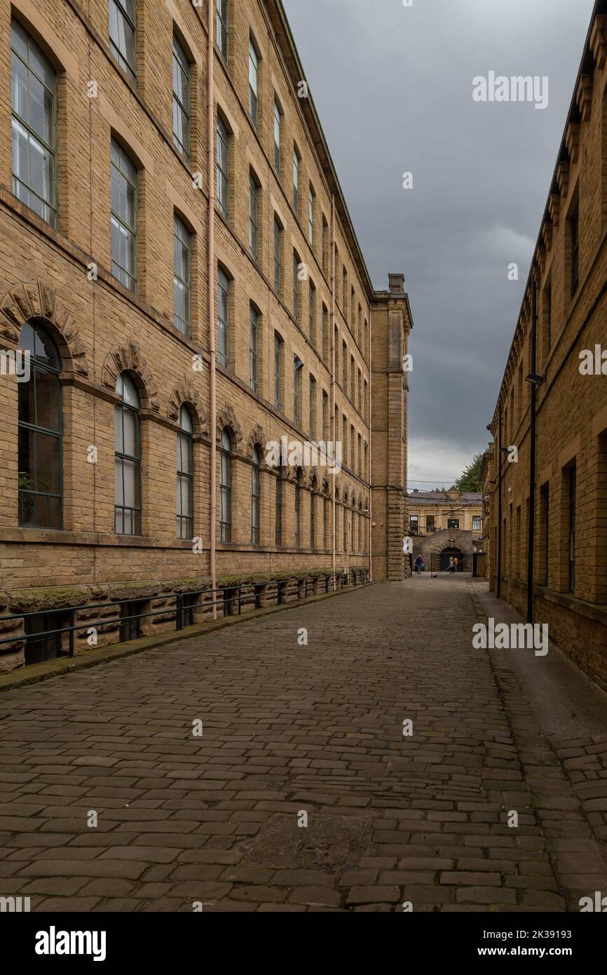 The magnificent Salts Mill building in Saltaire, Yorkshire. Salts Mill is a former textile mill, now home to an art gallery with small businesses. Stock Photo