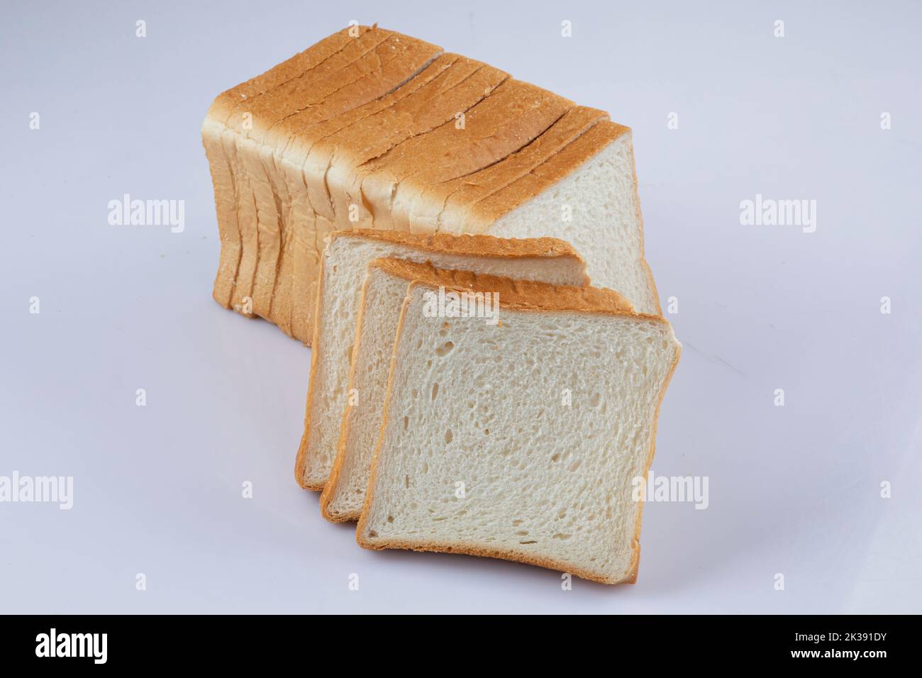 whole wheat bread slices on a white background Stock Photo - Alamy