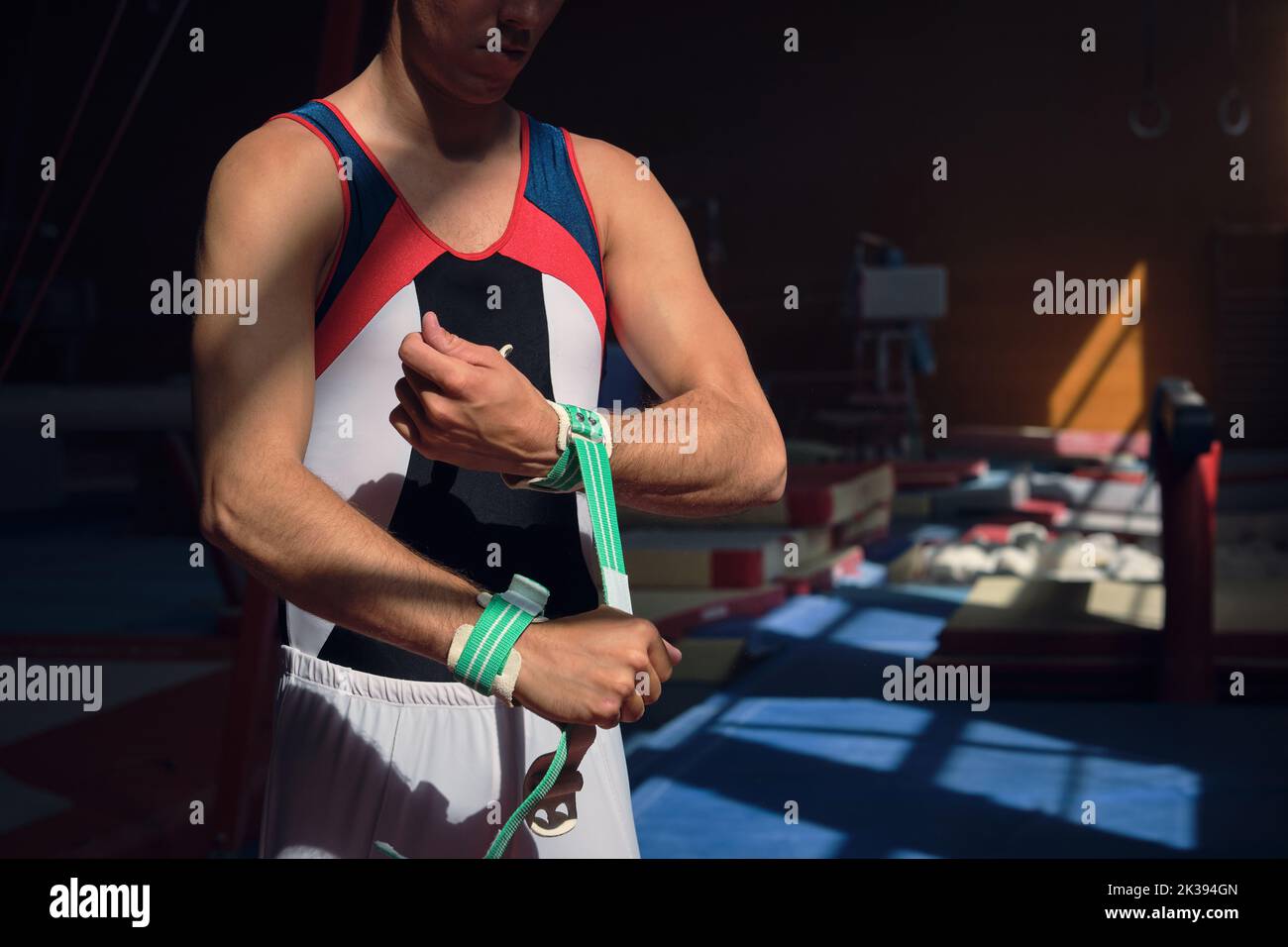 Unrecognisable person putting on wristbands to perform gymnastic exercises. Stock Photo