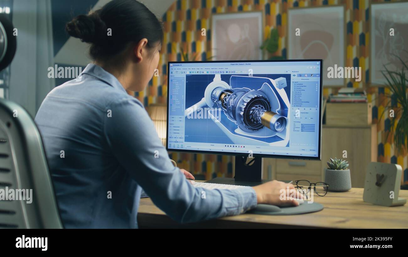 Asian female engineer drawing wind turbine 3D spare part in ...