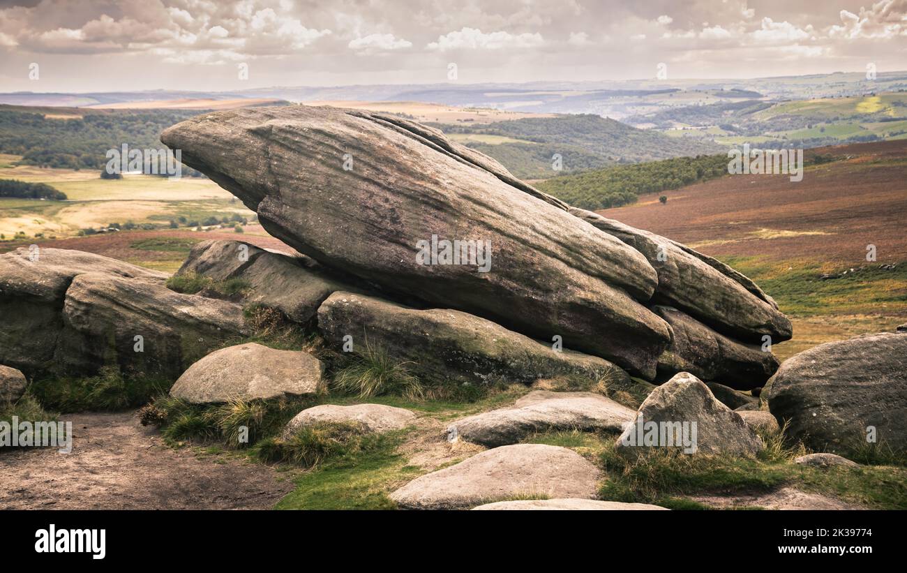 Higger Tor is a dominant landmark of the Dark Peak, in the north of the Peak District. It is a gritstone tor overlooking the Burbage Valley . Stock Photo