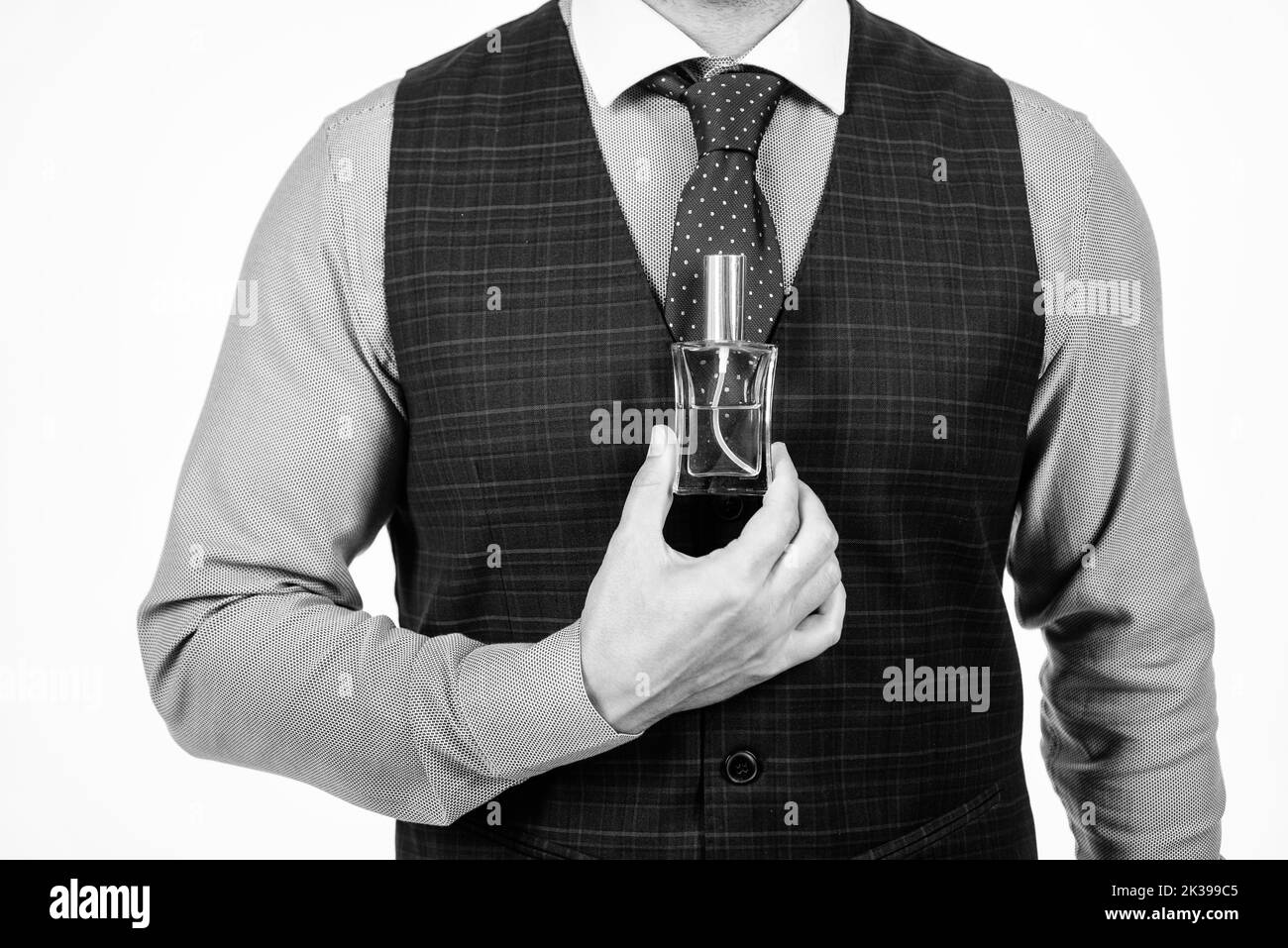 cropped man hold male perfume bottle, fragrance Stock Photo