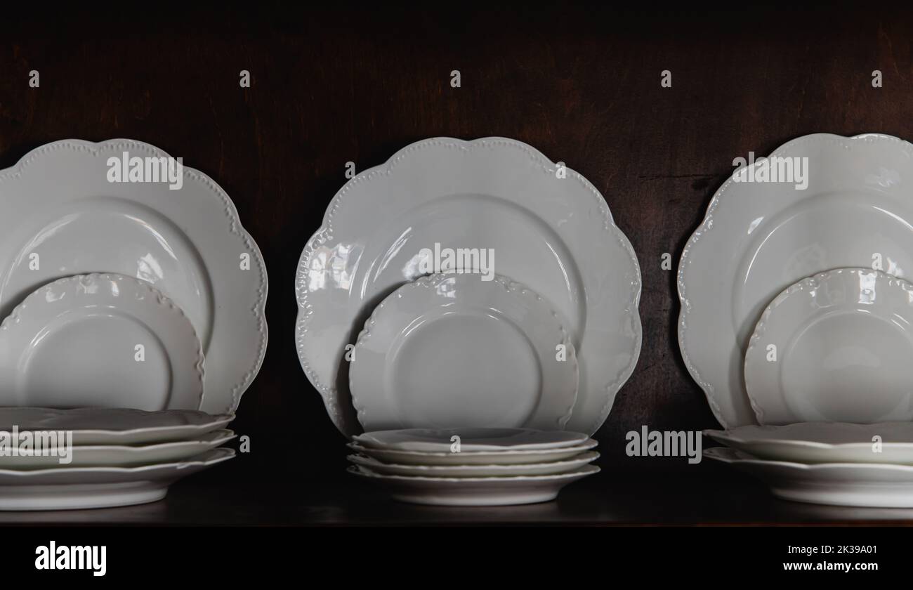 White Porcelain Dinner and Dessert Plates Stacked and Displayed in a