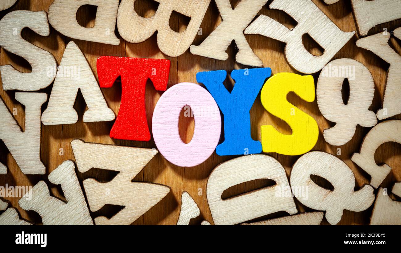 Toys word -  Inscription by colorful wooden letters Stock Photo