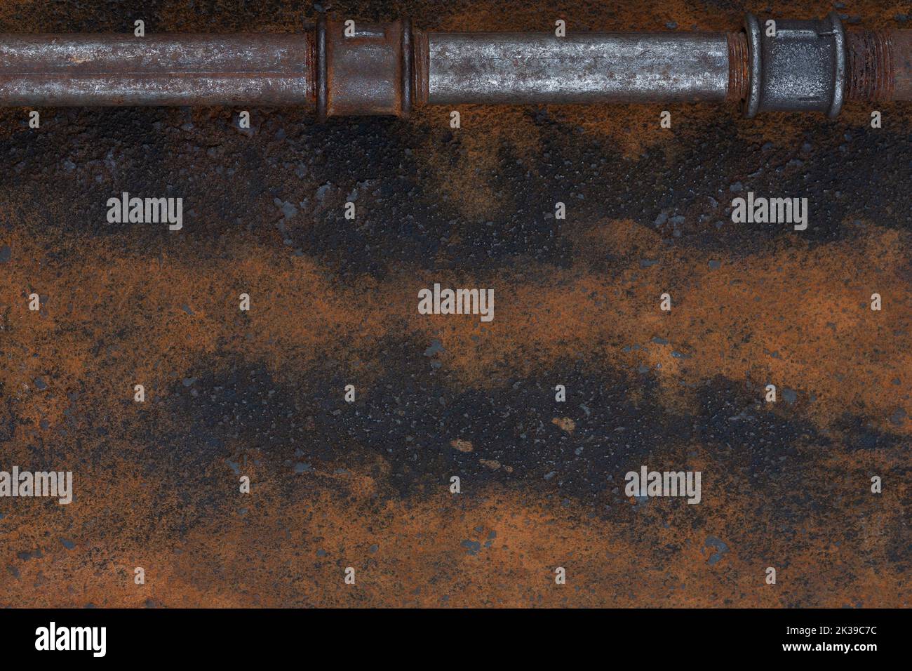 Old rusty valve pipes on rusty metal wall background Stock Photo - Alamy