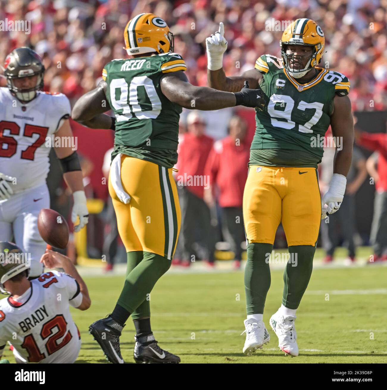 Tampa, United States. 25th Sep, 2022. Green Bay Packers' Jarran Reed (90) and Kenny Clark (97) celebrate a sack on Tampa Bay Buccaneers' Tom Brady (12) during the first half at Raymond James Stadium in Tampa, Florida on Sunday, September 25, 2022. Photo by Steve Nesius/UPI Credit: UPI/Alamy Live News Stock Photo