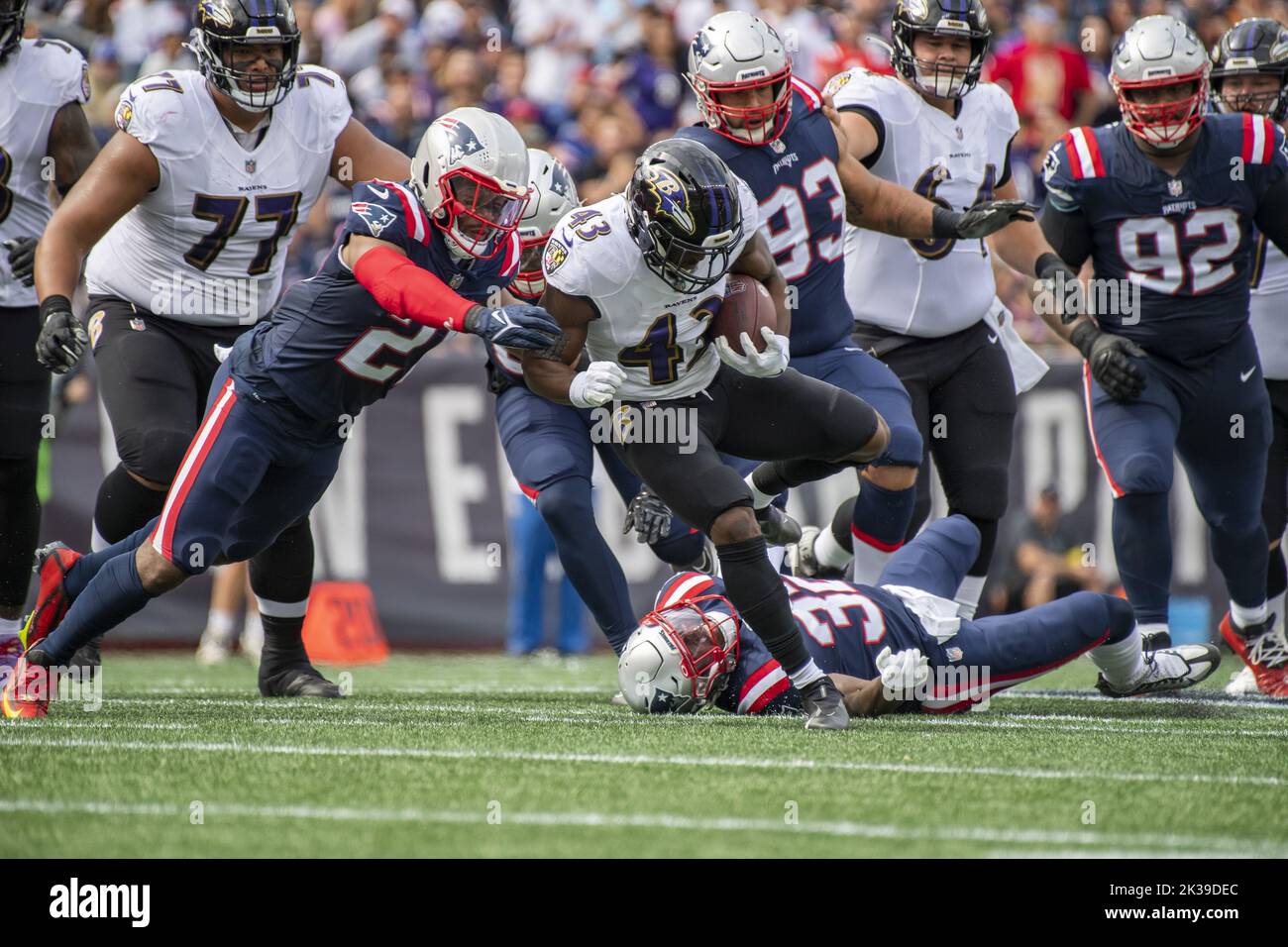 Foxborough, United States. 25th Sep, 2022. Baltimore Ravens Justice Hill is brought down by New England Patriots Adrian Phillips during a game at Gillette Stadium in Foxborough, Massachusetts on Sunday, September 25, 2022. Photo by Amanda Sabga/UPI Credit: UPI/Alamy Live News Stock Photo