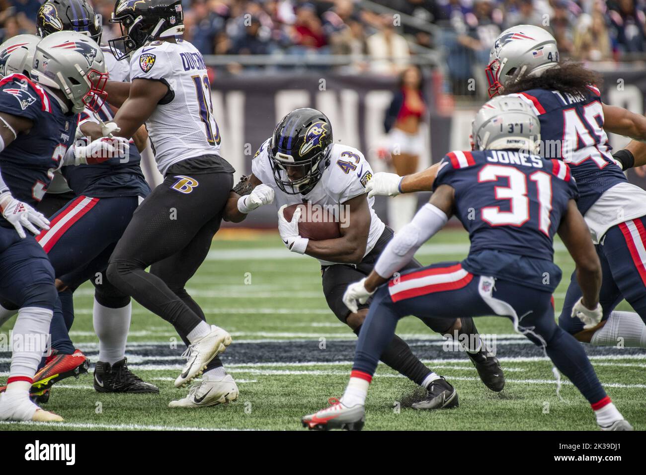 Foxborough, United States. 25th Sep, 2022. Baltimore Ravens running back Justice Hill runs the ball through New England Patriots defense during a game at Gillette Stadium in Foxborough, Massachusetts on Sunday, September 25, 2022. Photo by Amanda Sabga/UPI Credit: UPI/Alamy Live News Stock Photo