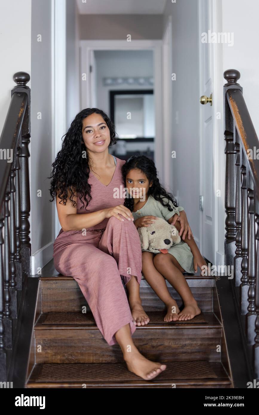 Full length girl holding stuffed animal hi-res stock photography and