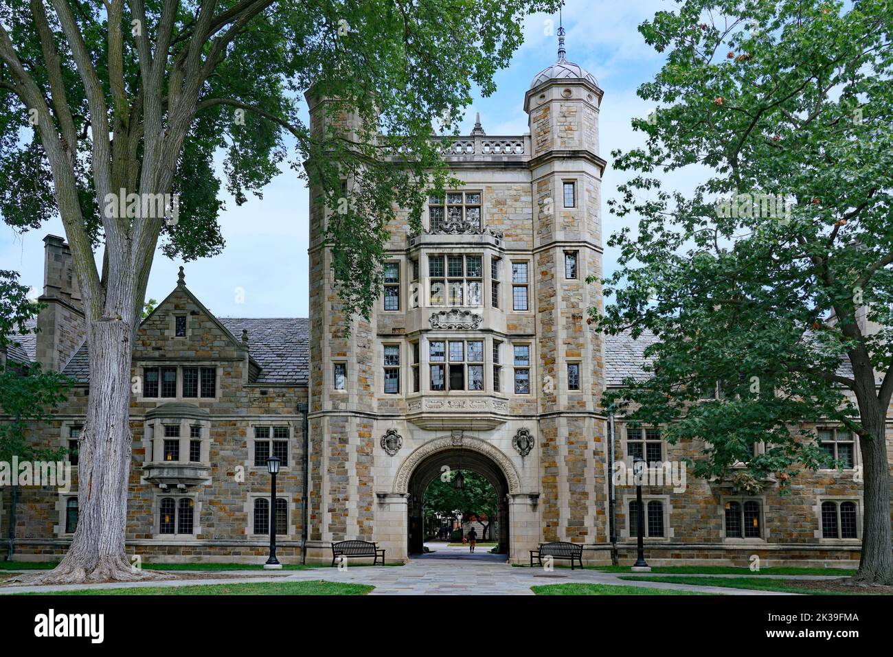 Ornate gothic style architecture at the University of Michigan, with an archway leading into a courtyard Stock Photo