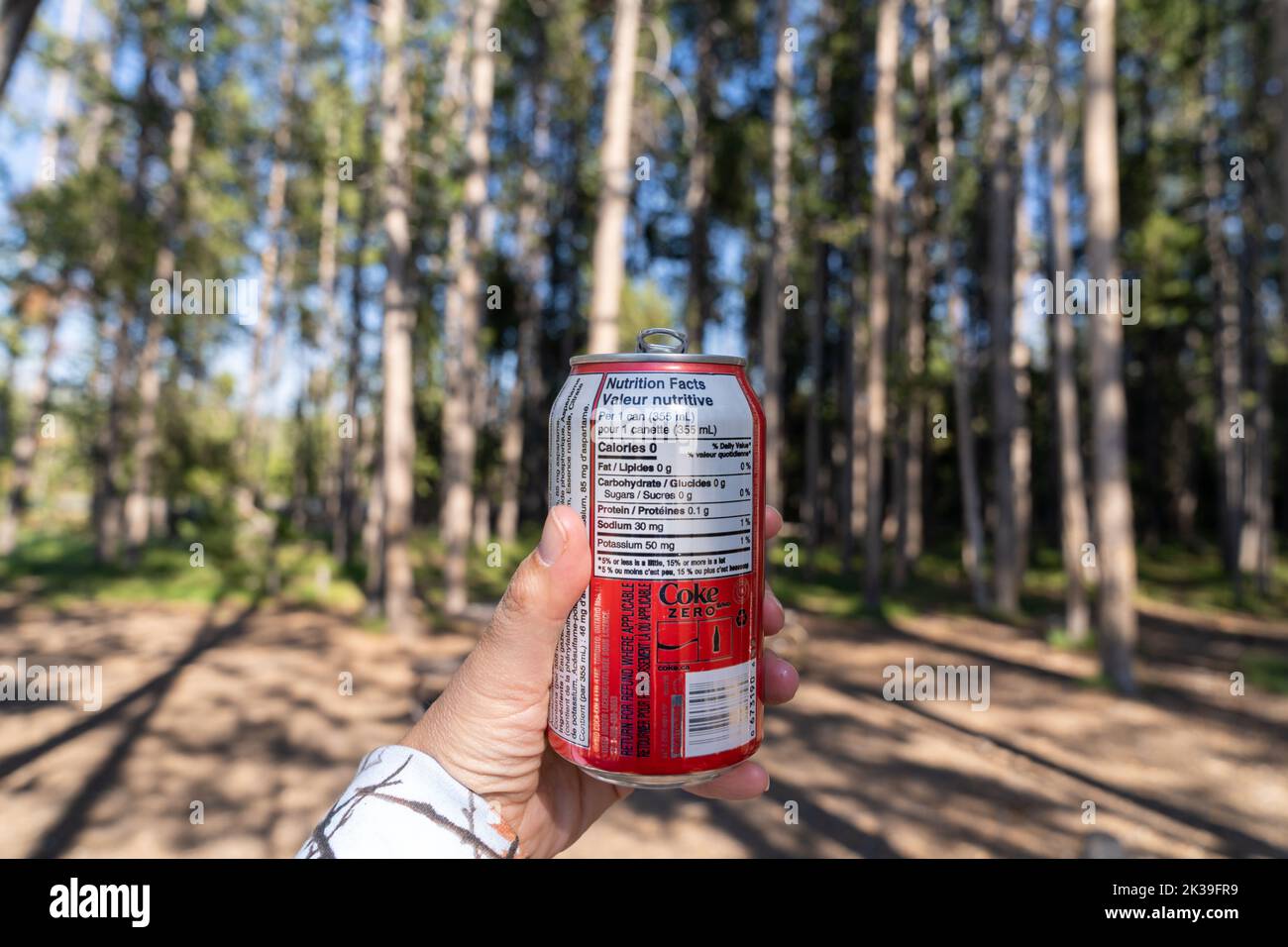 Wyoming, USA July 19, 2022 Hand holds up a CocaCola Zero Sugar can