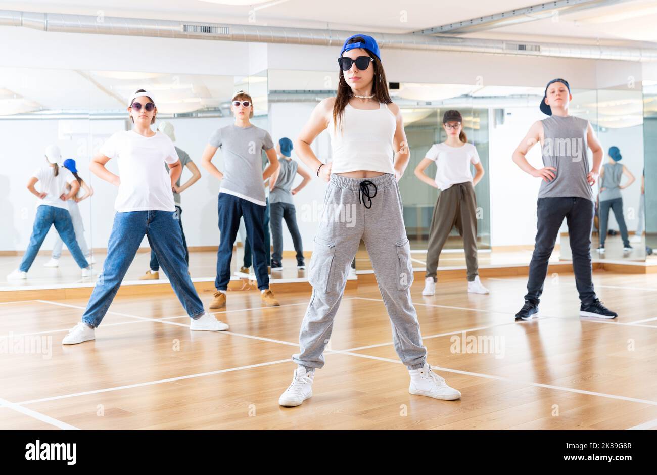 Teenagers training hip hop in dance studio Stock Photo - Alamy