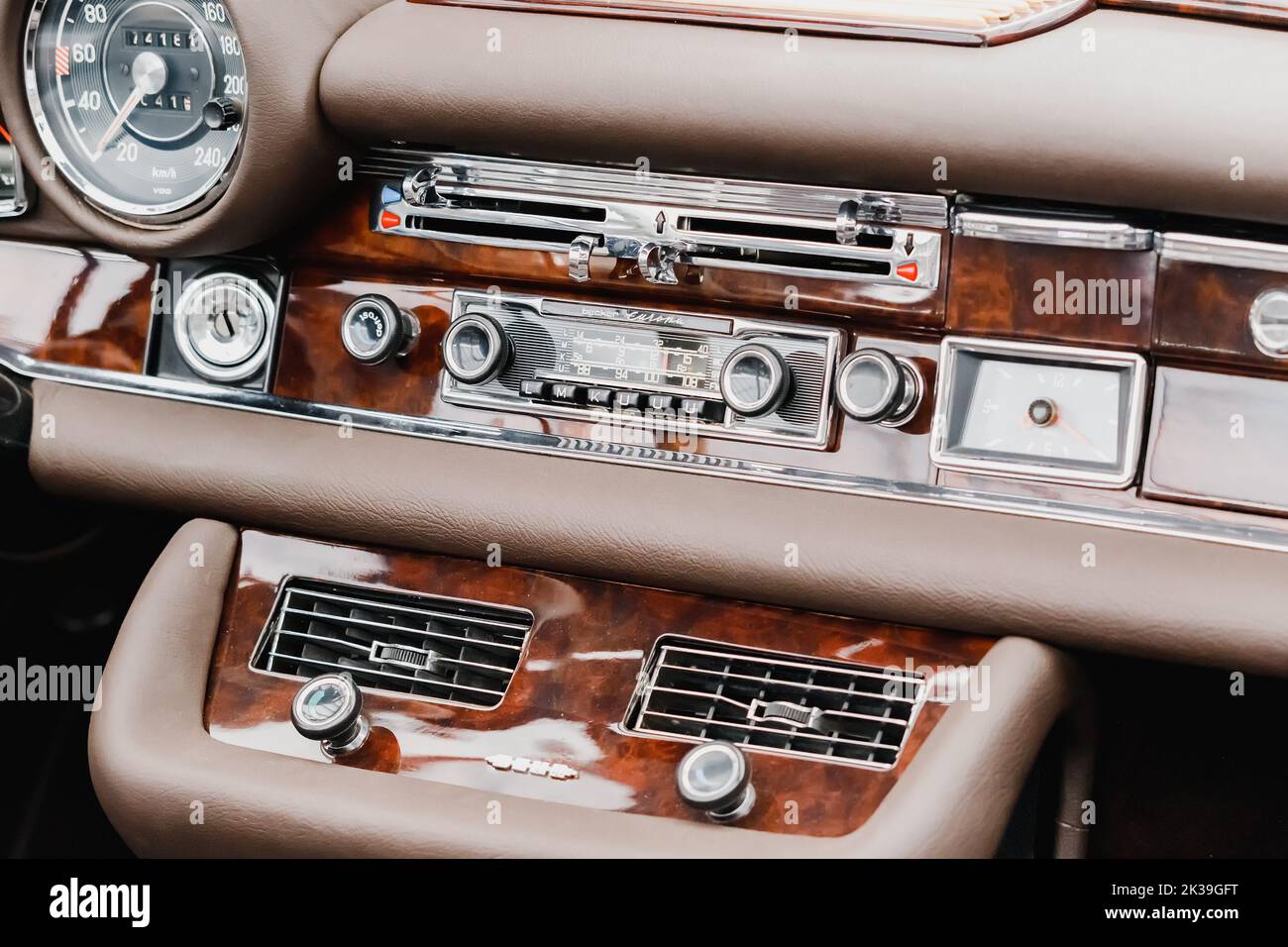 21 July 2022, Dusseldorf, Germany: Interior of a retro car with steering wheel and dashboard and radio Stock Photo
