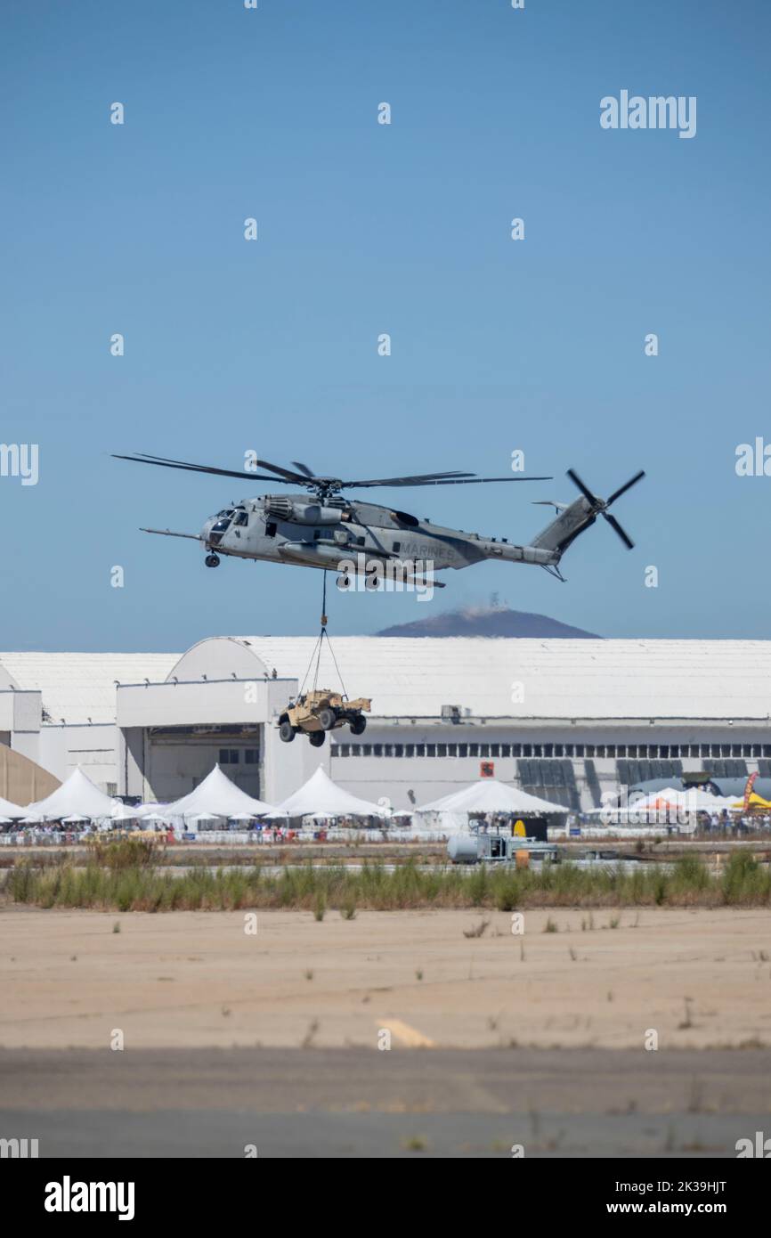 An CH-53E Super Stallion flies above the flight line during the Marine Air-Ground Task Force demonstration of the 2022 Marine Corps Air Station Miramar Air Show at MCAS Miramar, San Diego, California, Sept. 23, 2022. The MAGTF Demo displays the coordinated use of close-air support, armor, artillery and infantry forces and provides a visual representation of how the Marine Corps operates. The theme for the 2022 MCAS Miramar Air Show, “Marines Fight, Evolve and Win,” reflects the Marine Corps’ ongoing modernization efforts to prepare for future conflicts. (U.S. Marine Corps photo by Lance Cpl. I Stock Photo