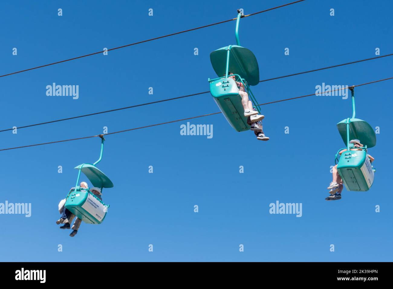 Calgary, Alberta, Canada - July 15, 2022: People enjoy the Calgary Stampede at the Stampede Park, from the sky ride chairs Stock Photo
