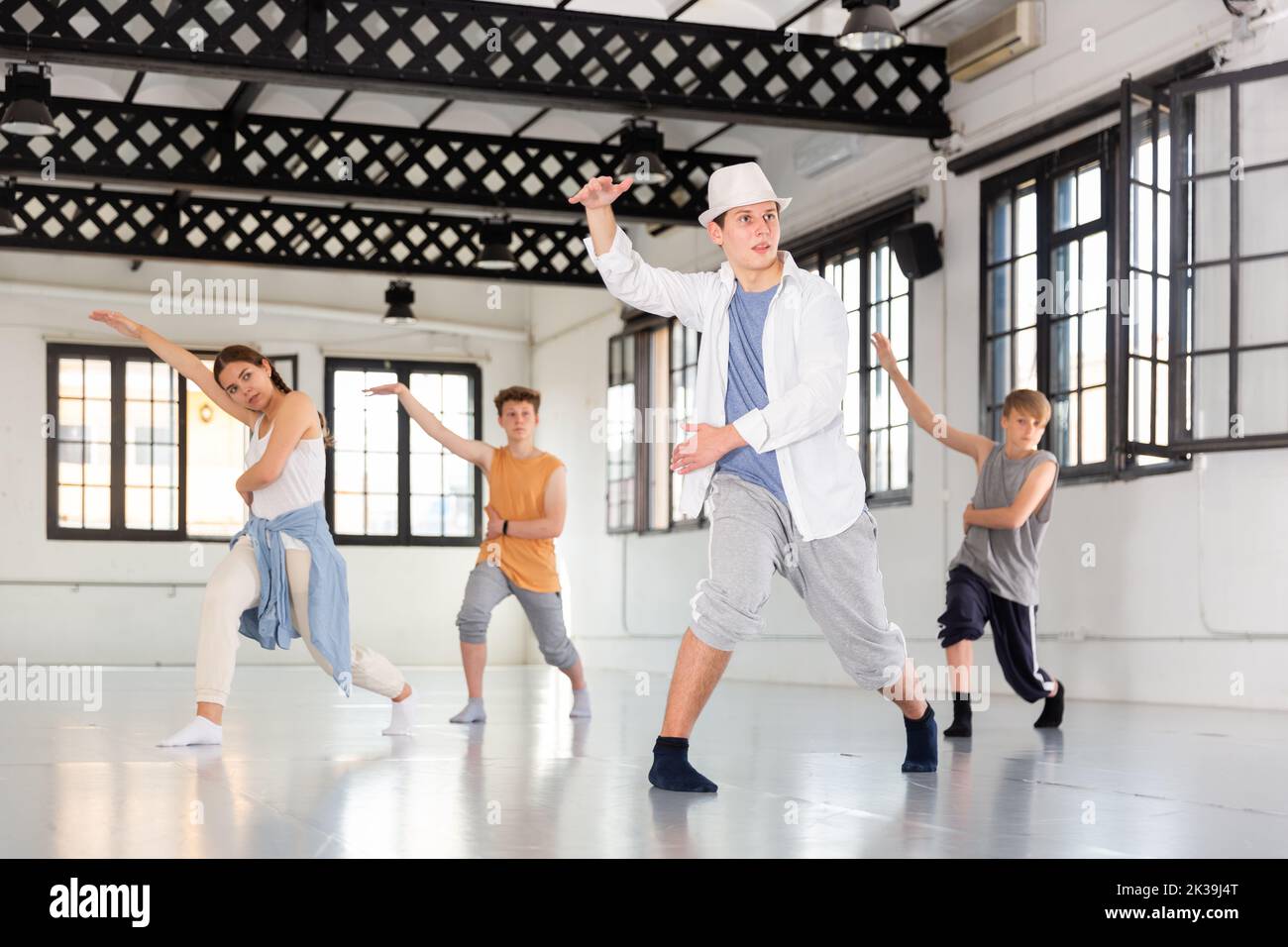 Teenagers training contemporary dance at studio Stock Photo