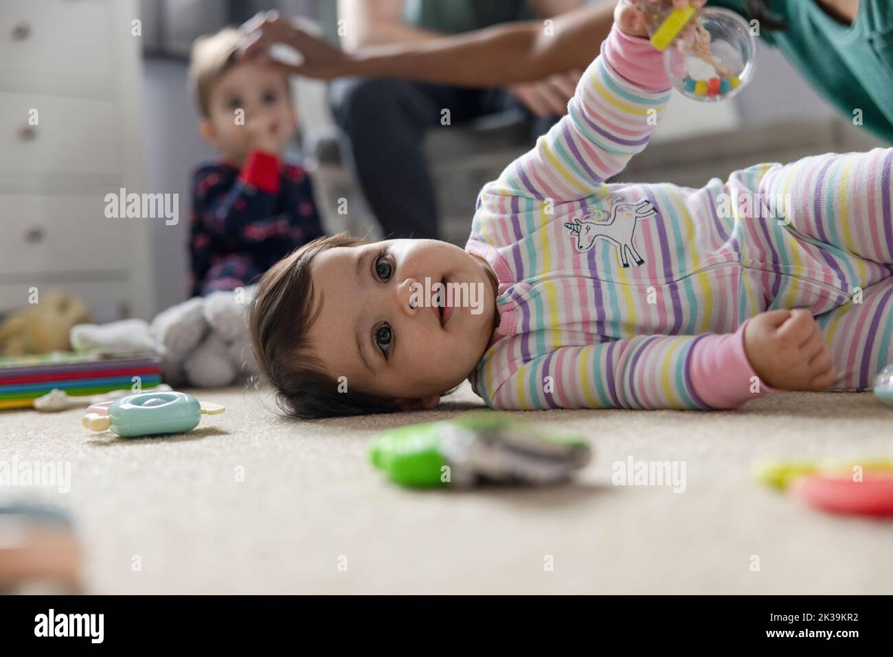 Beautiful baby girl laying on floor hi-res stock photography and images -  Alamy