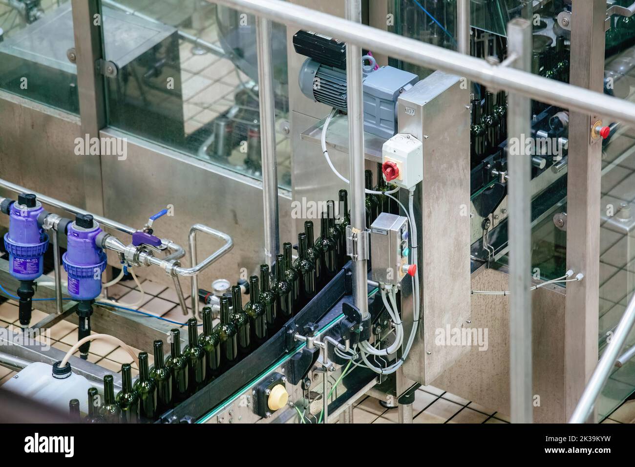 Bottling and sealing wine conveyor production line at modern winery Stock Photo