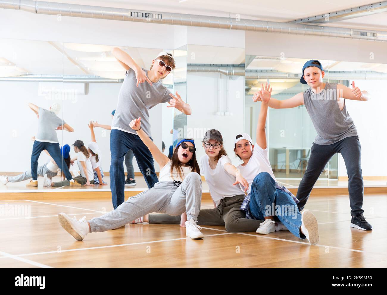 Teens hip hop dancers posing in studio Stock Photo - Alamy