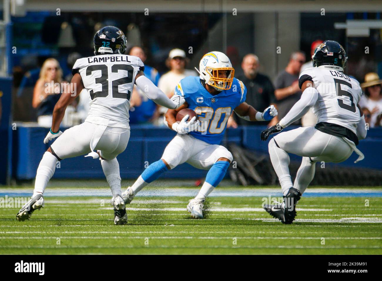 Los Angeles, California, USA. 25th Sep, 2022. Los Angeles Chargers running back Austin Ekeler (30) avoids a tackle from Jacksonville Jaguars cornerback Tyson Campbell (32) and free safety Andre Cisco (5) during the first half at an NFL football game, Sunday, Sept. 25, 2022, in Inglewood, Calif. (Credit Image: © Ringo Chiu/ZUMA Press Wire) Credit: ZUMA Press, Inc./Alamy Live News Stock Photo